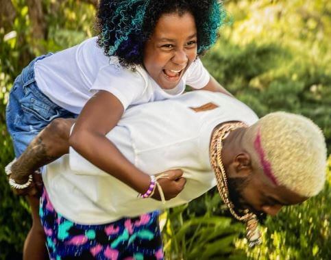 Vada Wamwene Mescudi with her father Kid Cudi.